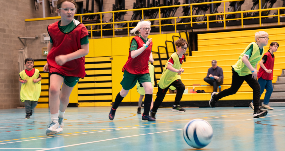 Children who are blind or vision impaired playing football