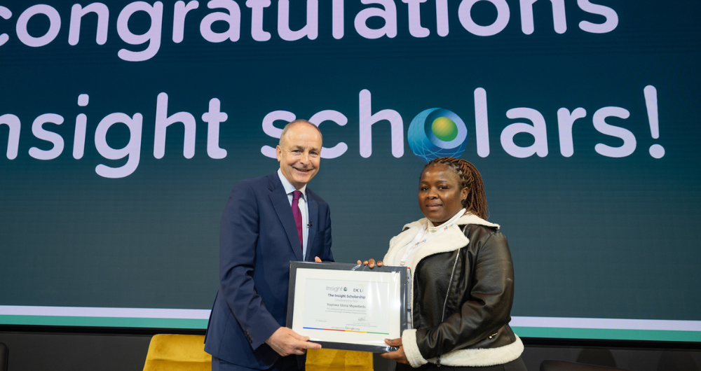 An Taoiseach Micheál Martin awarding scholarship to Vuyiswas Mgwebeda